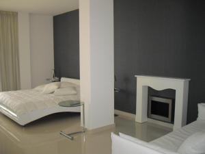 Voodi või voodid majutusasutuse Crystal Hotel toas