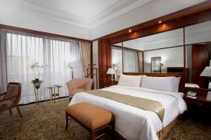 Postel nebo postele na pokoji v ubytování The Sultan Hotel & Residence Jakarta