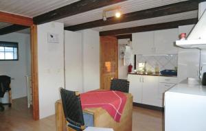 a kitchen with a small table in a room at Stunning Home In Tomelilla With Wifi in Bollerup