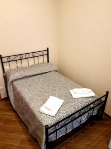 Кровать или кровати в номере Alexis Home