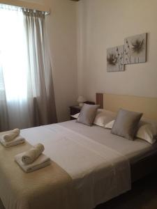 Postel nebo postele na pokoji v ubytování Apartmani Vela Luka