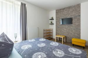 Ein Bett oder Betten in einem Zimmer der Unterkunft Apartmány Anička