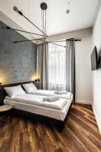 Posteľ alebo postele v izbe v ubytovaní Apartamenty Nowa Kamienica Częstochowa Centrum Szymanowskiego 22A