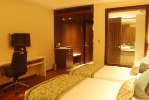Cama o camas de una habitación en Hotel Pluto's