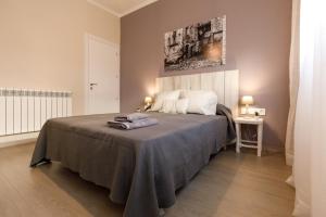 a bedroom with a bed with a blanket on it at Lo passeig in Tremp