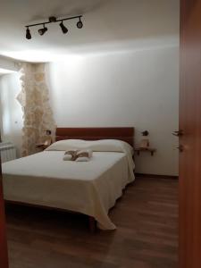Postel nebo postele na pokoji v ubytování Historical Domus