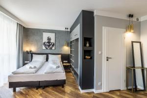 Posteľ alebo postele v izbe v ubytovaní Apartamenty Nowa Kamienica Częstochowa Centrum Szymanowskiego 22A