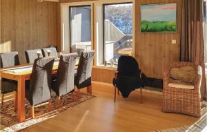 a dining room with a table and chairs at Beautiful Apartment In Hovden With House A Mountain View in Hovden