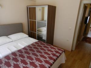 A bed or beds in a room at Hagia Sophia Apartment
