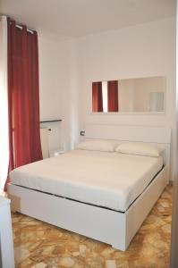 A bed or beds in a room at VIALE REPUBBLICA 307 2