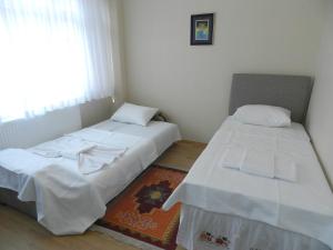 A bed or beds in a room at Hagia Sophia Apartment