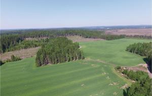 an aerial view of a large green field with trees at Beautiful Home In Väse With Kitchen in Ve