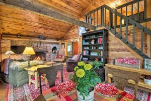 a living room with a staircase in a cabin at Ginny's Cabin in Spruce Pine