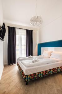 Posteľ alebo postele v izbe v ubytovaní Apartamenty Nowa Kamienica Częstochowa Centrum Szymanowskiego 22A