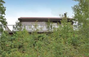 an old house in the middle of the trees at Nice Home In Vetlanda With Wifi in Stenberga
