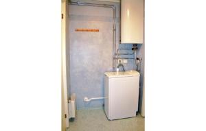 a bathroom with a sink and a shower at Gorgeous Home In Färjestaden With Wifi in Färjestaden +4 photos