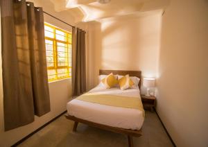 Voodi või voodid majutusasutuse Cactus Hostel & Suites toas