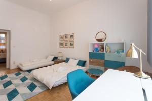Łóżko lub łóżka w pokoju w obiekcie Vintage Design Apartment