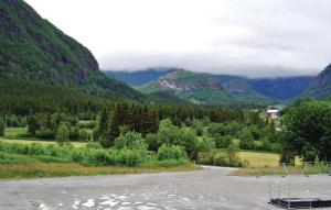 a parking lot with mountains in the background at Nice Apartment In Hemsedal With Wifi in Hemsedal