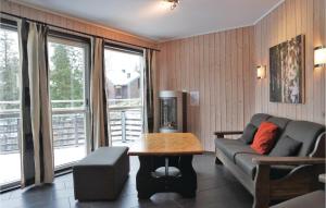 a living room with a couch and a table at 2 Bedroom Awesome Apartment In Hemsedal in Hemsedal
