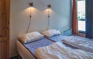 two beds in a room with two pillows on them at Beautiful Apartment In Hemsedal With House A Mountain View in Hemsedal