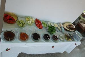 a table with many bowls of food on it at Rose Pension in Dalyan +29 photos