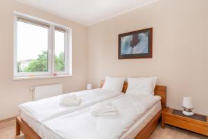 Posteľ alebo postele v izbe v ubytovaní Comfy Apartments with Balcony Turystyczna Międzyzdroje by Noclegi Renters