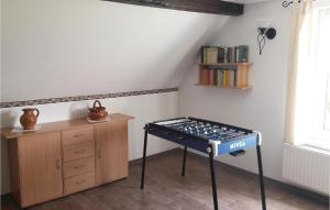 a table in the corner of a room with books at Awesome Home In Alt Schwerin With Wifi in Alt Schwerin