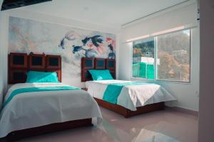 Postel nebo postele na pokoji v ubytování Hotel Casa Arnaldo "Esmeraldas" + 26 fotografií
