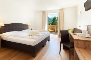 Voodi või voodid majutusasutuse Hotel Sole - Sonne toas