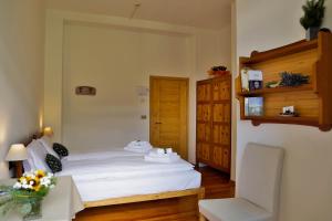 Postel nebo postele na pokoji v ubytování Hotel Roseg + 6 fotografií