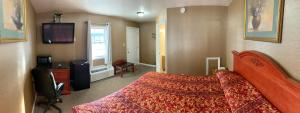 Säng eller sängar i ett rum på Dutch Motel Palmyra
