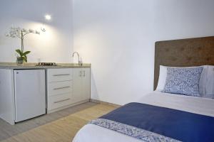 Postel nebo postele na pokoji v ubytování Los Milagros Hotel
