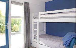 a bedroom with a bunk bed and a window at Nice Home In Workum With 3 Bedrooms And Wifi in Workum