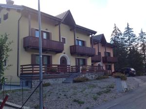 a house with balconies on the side of it at Residence Grand Hotel SIVA - Adults Only in Santo Stefano dʼAveto