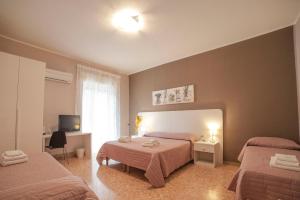 Postel nebo postele na pokoji v ubytování B&B Siracusa Holidays