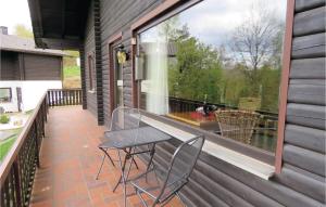 a patio with a table and chairs on a balcony at Ferienhaus 8 In Thalfang in Thalfang
