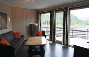 a living room with a couch and a table at Beautiful Apartment In Hemsedal With Sauna in Hemsedal