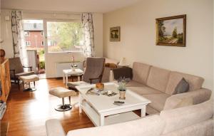 a living room with a couch and a table at Beautiful Apartment In Hyltebruk With 2 Bedrooms And Wifi in Hyltebruk