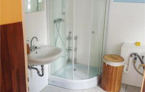 a bathroom with a shower and a sink and a sink at Lovely Apartment In Linz Am Rhein in Linz am Rhein