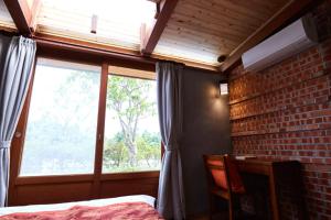 Voodi või voodid majutusasutuse Chang House toas