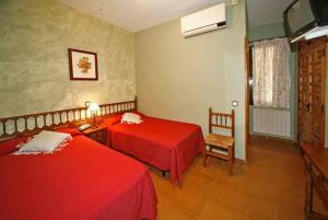 Cama o camas de una habitación en Hostal Chinchon