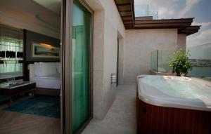 a bathroom with a tub and a sink at Radisson Blu Hotel Istanbul Pera in Istanbul