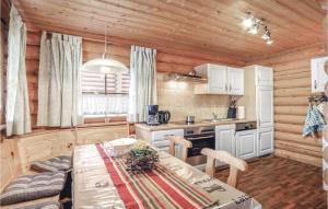 a kitchen with a table in a cabin at Amazing Home In Harzgerode-dankerode With Wifi in Dankerode