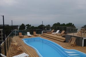 a swimming pool on the roof of a building at Resolute Shekvetili Hotel in Shekhvetili