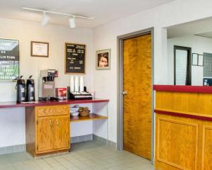 a fast food restaurant with a counter and a door at Econo Lodge in Mifflintown