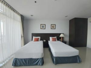 Ένα ή περισσότερα κρεβάτια σε δωμάτιο στο Ampo Residence