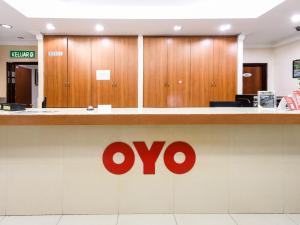 an oro sign on a counter in a hospital at Super OYO 707 Ayuni Hotel in Bangi