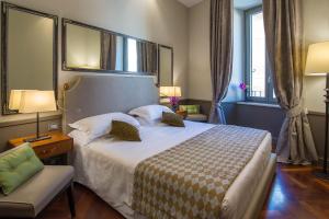 Postel nebo postele na pokoji v ubytování Hotel Lunetta