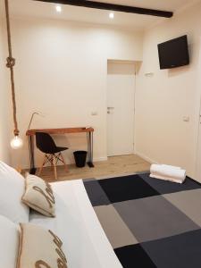 Letto o letti in una camera di B&B Gisira